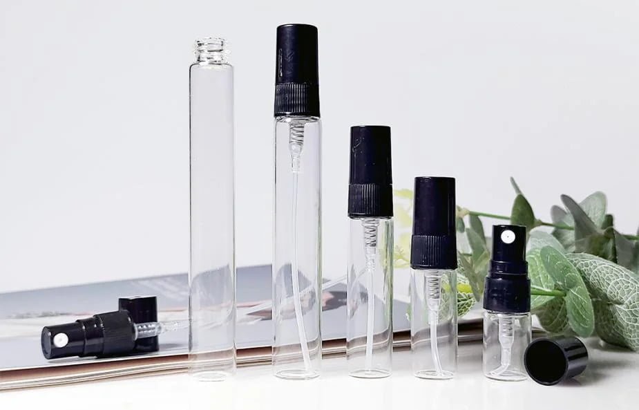 Transparent spray bottles of different sizes