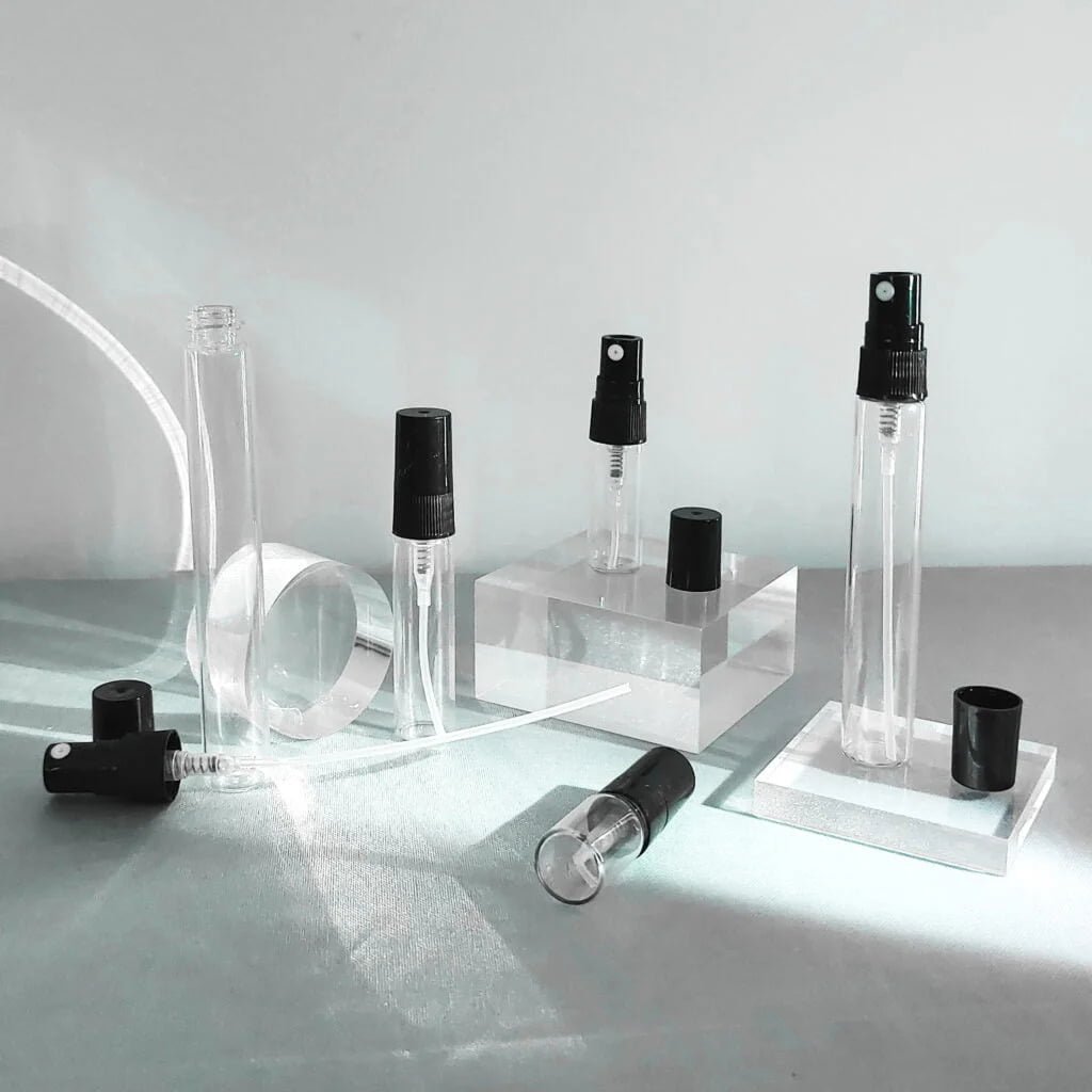 Transparent spray bottles of different sizes